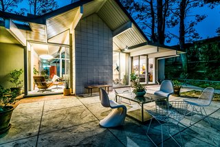 The quarter-acre lot includes several patio areas and a barbecue, and has plenty of space for a potential pool.