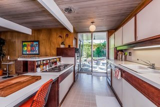 The same patio leads to the all-original kitchen...