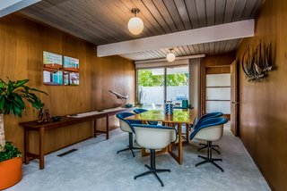 The living room flows into the dining room, which has access to a small covered patio.
