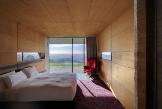 An Internationally Celebrated Home in the Australian Backcountry Asks $9M - Photo 9 of 13 - The four bedrooms are encased in warm plywood, offering intimacy while still providing access to grand vistas. 