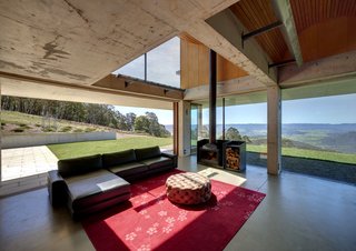 An Internationally Celebrated Home in the Australian Backcountry Asks $9M - Photo 6 of 13 - A wood-burning stove and hydronic and geothermal heating systems ensure that the residence is warm and inviting despite its openness to the outdoors.