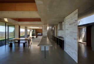 An Internationally Celebrated Home in the Australian Backcountry Asks $9M - Photo 4 of 13 - The pantry, kitchen, living, and dining room are in one seamless circulation that leads to a northern terrace and a central outdoor courtyard.