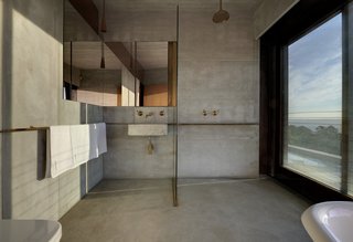 An Internationally Celebrated Home in the Australian Backcountry Asks $9M - Photo 10 of 13 - One of the bathrooms is lofted on the second level alongside two other bedrooms.