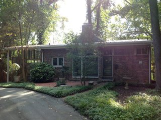 Architect Janice Finein shared a photo of the residence before the renovation. "We changed the roof lines, extended the height of the brick wall, replaced the windows and doors, as well as added new materials and details," she says. 