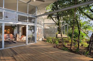 A Community-Oriented Vacation Rental in Panamanian Paradise - Photo 1 of 8 - The open plan compound consists of Casa Norte and Casa Sur, two units that share an atrium entryway with large doors that roll open or closed to join or connect the two spaces. Much of the shape of Casa Comunal derives from the existing flora on the site, which includes many fruit-bearing trees.