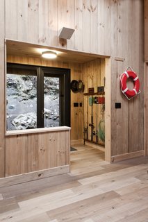 A mudroom has storage space for fishing gear, wet shoes, and jackets.