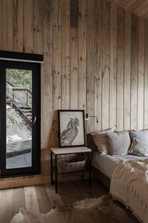 The master bedroom has a walk-in closet and en suite bathroom; on the other side of the house, another bedroom sleeps four, and a loft space provides two additional beds.