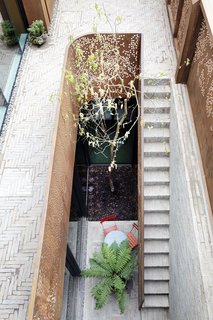 A sunken courtyard acts like a light well illuminating the basement, which is currently set up as a playroom, though it can be renovated to become additional bedrooms, an office, a self-contained studio, or even a lap pool.