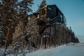 <span style="font-family: Theinhardt, -apple-system, BlinkMacSystemFont, "Segoe UI", Roboto, Oxygen-Sans, Ubuntu, Cantarell, "Helvetica Neue", sans-serif;">An extension of Treehotel’s mission of bringing modern design to a serene natural environment, the 7th room is a cabin lofted among the treetops that blurs the distinction between indoors and outdoors. Designed by the renowned firm Snøhetta, the structure hovers 10 meters above the ground with a black-and-white print of the canopy covering the bottom façade, creating a trompe l'oeil effect.</span><span style="font-family: Theinhardt, -apple-system, BlinkMacSystemFont, "Segoe UI", Roboto, Oxygen-Sans, Ubuntu, Cantarell, "Helvetica Neue", sans-serif;"> </span>