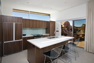 Offered at $674K, This Hybrid Prefab Is in Tune With the Californian Desert - Photo 4 of 7 - The kitchen boasts cabinets from a high-end Canadian vendor. Large cork tiles run throughout the home.