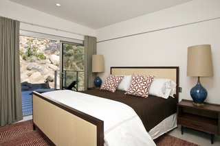 Offered at $674K, This Hybrid Prefab Is in Tune With the Californian Desert - Photo 5 of 7 - Both bedrooms are a step away from the outdoors and have integrated cabinets along one wall for seamless storage. 