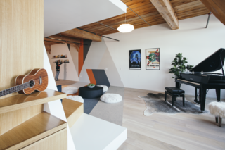 In playful mashup of 3D and 2D elements, a wall mural echoes the FLOR carpet tiles that accent the natural oak engineered flooring. "We looked at Monument Valley more as an environment of possibilities than simply a game," says Pande. "We really wanted to play on the premise of constantly shifting conditions created by geometric manipulations."