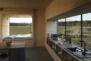 Beginning with a 36-square-meter living room, Grundmann added glass cubes that function as living spaces as well as windows. 