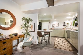 The living room leads to the kitchen, which features a pony wall for bar seating.