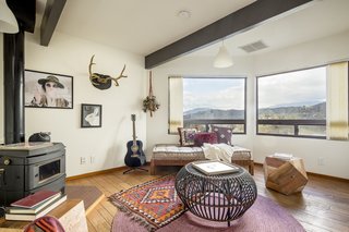 Complete with a Franklin stove, one of the bedrooms can be easily converted into an office or study.