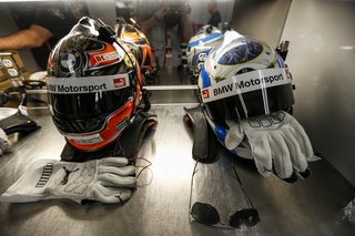In the BMW motorhome, fans are directed at helmets to dry off the sweat.