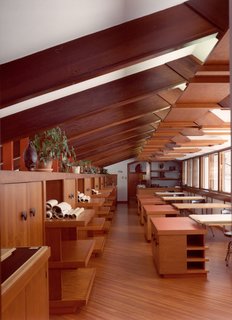 Alden B. Dow: The Mastermind of Midwestern Modernism - Photo 3 of 7 - In the first drafting room, a row of windows on the northern facade provides illumination for the drafting tables below. The chairs are original, while the desks are reproductions of the flat tabletops that allowed Dow to offer suggestions as he walked down the aisle.