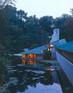 Alden B. Dow: The Mastermind of Midwestern Modernism - Photo 2 of 7 - One of the most stunning moments in the studio is the conference room, otherwise known as the Submarine Room, which is embedded 18 inches below the surface of the pond. Here, Dow met with his clients, immersing them in the idea that nature and architecture are intimately connected. Says Craig McDonald, director of the Alden B. Dow Home & Studio, "With reflective light shining around the room, the space is relaxing and dynamic. Dow created an environment for his clients to define what a home was." 