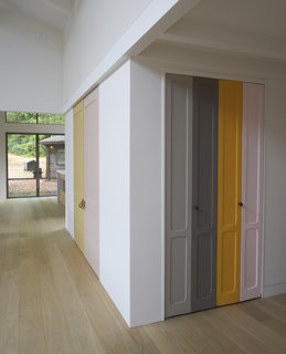 A Northern Californian Renovation Brings Warmth to the Wilderness - Photo 1 of 6 - Playful panels of color on closet doors and the stair risers break up the white walls. The homeowner explains, "I took as inspiration Imi Knoebel, whose work I had seen at the Dia Beacon, and who works with large shapes of color placed in relationship to one another."