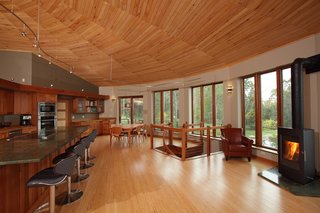 A Round Pennsylvania Prefab Offers 360-Degree Solutions in Sustainability - Photo 1 of 7 - Founded in 1968, Deltec Homes is known for hurricane-resistant, energy-efficient homes, offered in round, traditional, and modern prefabricated kits. The round structure provides better airflow while reducing surface area, reducing heat gain and loss. "The shell is so efficient that we haven't turned on our central heating system for the main bulk of the winter in three years," says Sanders.