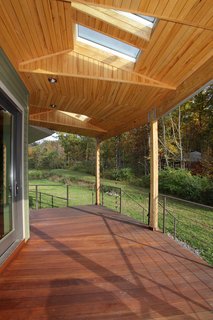 A Round Pennsylvania Prefab Offers 360-Degree Solutions in Sustainability - Photo 6 of 7 - The round home provides panoramic views of the surrounding woods and water.