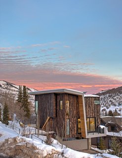 A Plunging Roof Carves Out Space in This Park City Home Offered at $2.4M - Photo 1 of 9 - The residence is sited to maximize sunset views. The location, just outside of the historic district, allowed the homeowners to stay close to the heart of town while being able to build a contemporary house.