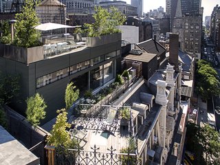 A Rooftop Addition on a 19th-Century Building Suits a Growing Family’s Needs - Photo 1 of 9 - Perched atop the historic Gilsey House, the J+K Residence also overlooks a storied neighborhood. The land, located north of Madison Square, was one of New York's last remaining family farms before becoming a bustling theater district. It then devolved into a neglected wholesale district until being rediscovered by artists and entrepreneurs.