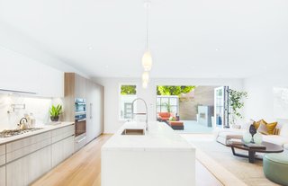 Here, Ultimate Bi-Fold Doors extend a interior living space into a open-air courtyard.