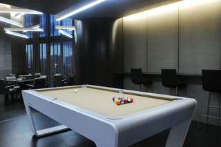 Multipurpose clubrooms offer residents and guests entertainment options outside of their units. A movie theatre plays new releases, while a game room is equipped with racing and golf simulators. 