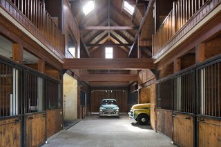 After Kelley's wife moved the horses to another property, he used one of the outbuildings as a design studio, and repurposed the barn for his classic car collection.