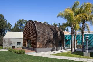 The disjunction between each pavilion is most visible from a rear view, which reveals the variety of materials used, from glass to wood to brick. 