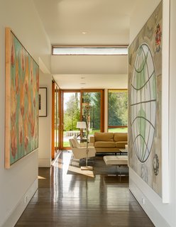 Mahogany windows and doors, black walnut floors, and beech veneer millwork create warmth in the bright interior.