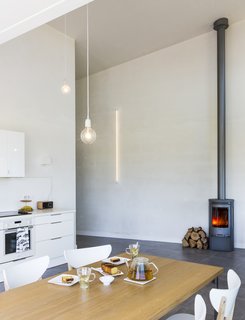 A C500 wood-burning stove from Contura creates a cozy atmosphere.