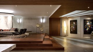 Here’s How Hollywood Builds a Malibu Dream Home—on a Vancouver Soundstage - Photo 6 of 10 - Two Oda Lamps by Sebastian Herkener create a soft glow on the raised dais, while two paintings reminiscent of Jean-Michel Basquiat liven up the space. Read explained that because of the number of closeups in television, backgrounds run the risk of seeming "dead." She says, "In every direction, there has to be a party going on because the lens need something to feature."