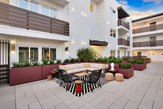 "We provide homeowners and architects with the opportunity to find the paver that enhances the shapes of their own projects," says Stepstone owner Gordon McWilliams. "Our products are part of the project environment." Here, Pedestal Set Roof Pavers set the scene for a graphic lounge area at the Micropolitan apartments in Los Angeles, California.