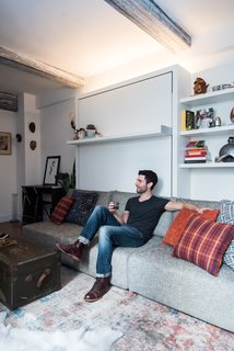 Strip lights above the Swing unit add height to the studio. ConcreteWall wall covering from Resource Furniture adorns the ceiling beams, an idea from designer Mike Harrison, who incidentally outfits many Broadway stars' dressing rooms.