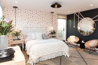 Kristen Peña's goal for the teen bedroom was to create a "cozy, livable haven for a 13-year-old girl that would embrace her during her transformation from girl to woman." The blush pink and black hues represent this dichotomy, while textural elements like a handwoven Peg Woodworking headboard and rope lights by local artist Windy Chien add warmth. "We feel that texture is very important in creating both that cozy feel and a level of sophistication in the room," says the designer.