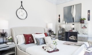 Beth Martin's master bedroom takes advantage of ample natural light with a mirrored fireplace mantle.