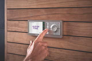Turn Your Bathroom Into a Private Sanctuary With These Upgrades - Photo 5 of 5 - Large, intuitive-to-use buttons save your presets on the U by Moen controller, which is designed to blend into a variety of bathroom styles.