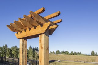 Redwood arbors feature two posts connected by a cross piece. Besides adding visual interest to an exterior space, they can also be built with a gate, bench, or planter box for added functionality.