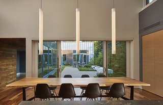 An Accessible Home Promotes a Lifetime of Well-Being For the Whole Family - Photo 4 of 7 - Large sliding doors allow the dining area to flow into the courtyard. 