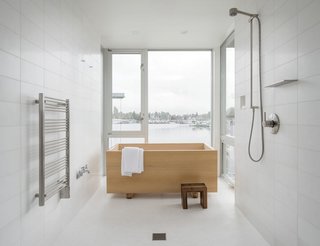 Overlooking Portage Bay in Seattle, this house was designed by Heliotrope Architects for a bachelor who longed for a simple bathroom with a Japanese-style hinoki tub that was installed in front of the windows for the water views.
