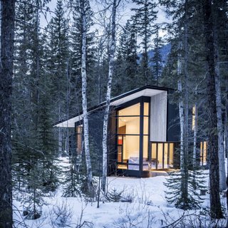 Form & Forest have designed the ultimate modern cabin that you can actually rent! Surrounded by wilderness, the retreat sits on the Blaeberry River near Golden, British Columbia with vaulted ceilings in the living room that afford incredible views of the forest, mountains, and river.