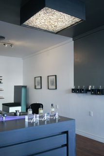 Hundreds of test strips create a modern light fixture for the boutique