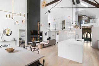 An old church in Chicago, Illinois was handed over to Linc Thelen Design and Scrafano Architects to be converted into a modern home for a family with three young children. The 25-foot ceilings, white surfaces, and wood floors make the space feel grand without being overwhelming or overdone.