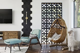 From the interior, the reclaimed breeze blocks filter the morning light and provide privacy.