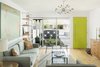 Modern home with Living Room, Coffee Tables, Console Tables, Sofa, Chair, Light Hardwood Floor, Pendant Lighting, Shelves, End Tables, and Rug Floor. Living room to front court Photo 10 of Beadle Buddy