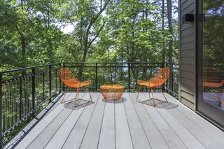 Take it Outside With These 11 Spring-Friendly Deck Spaces - Photo 5 of 11 - The clients desired a home that could celebrate the lakeside site and provide private spaces for the owners and their guests—yet also be a place for everyone to gather. Creating a connection to the outside was of most importance, through the large windows and sliding glass doors.