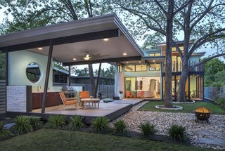 Underneath the fire pit, sits a french drainage system. The custom bbq area mimics design elements located in the home.