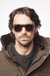 The NL-6: Inspired by vintage mountaineering glasses. Outfitted with genuine leather sides originally designed to block glare while mountain climbing or traveling on glaciers. This style is a modern interpretation of the classic circular look.